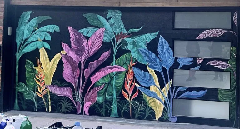 Hand-painted tropical mural on a residential garage door in Toronto