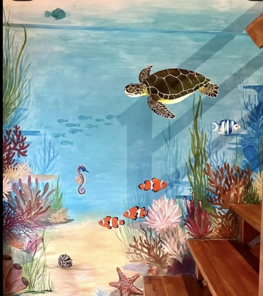 Custom underwater-themed wall mural with layered colour and fine detail
